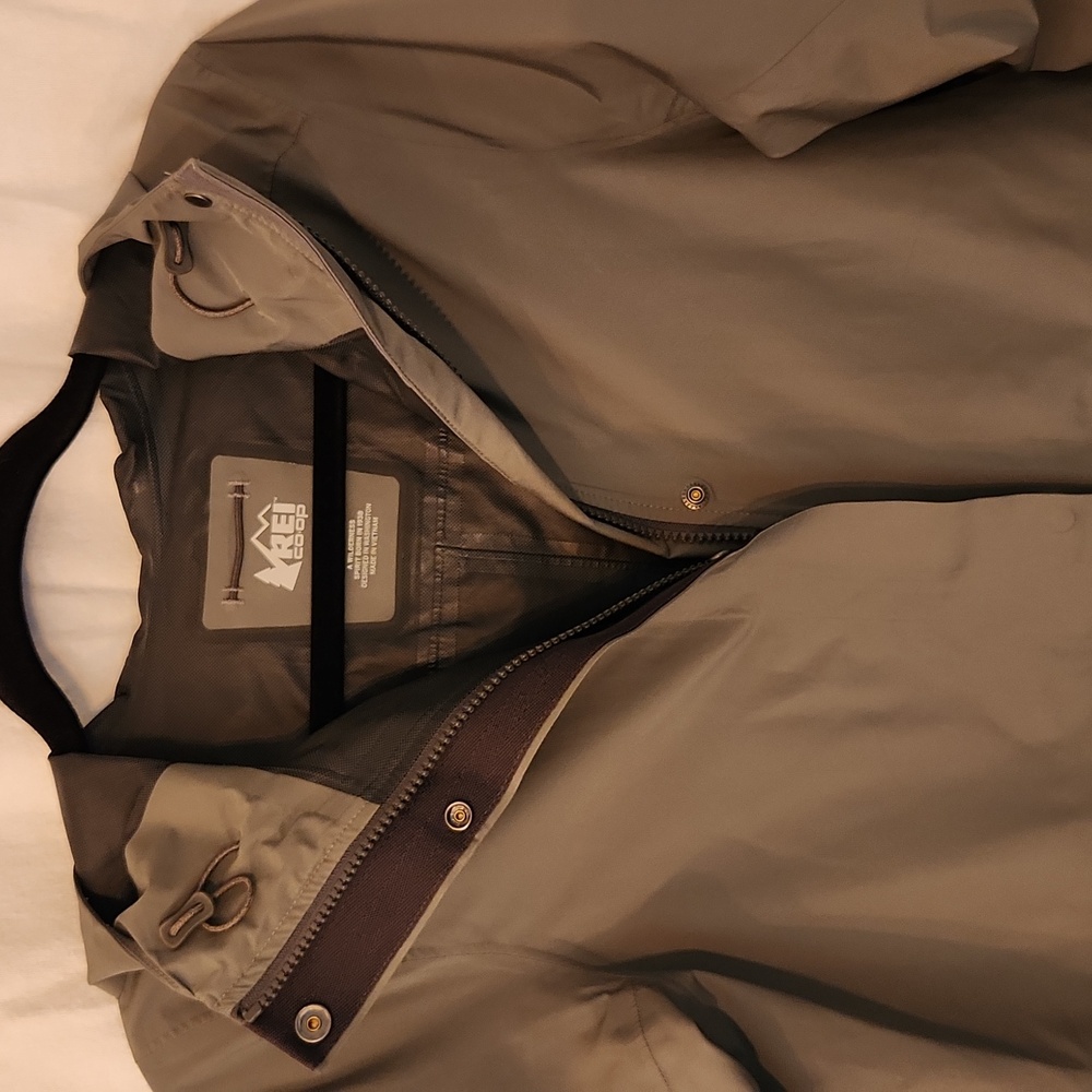 REI Women's long cinched waist rain jacket